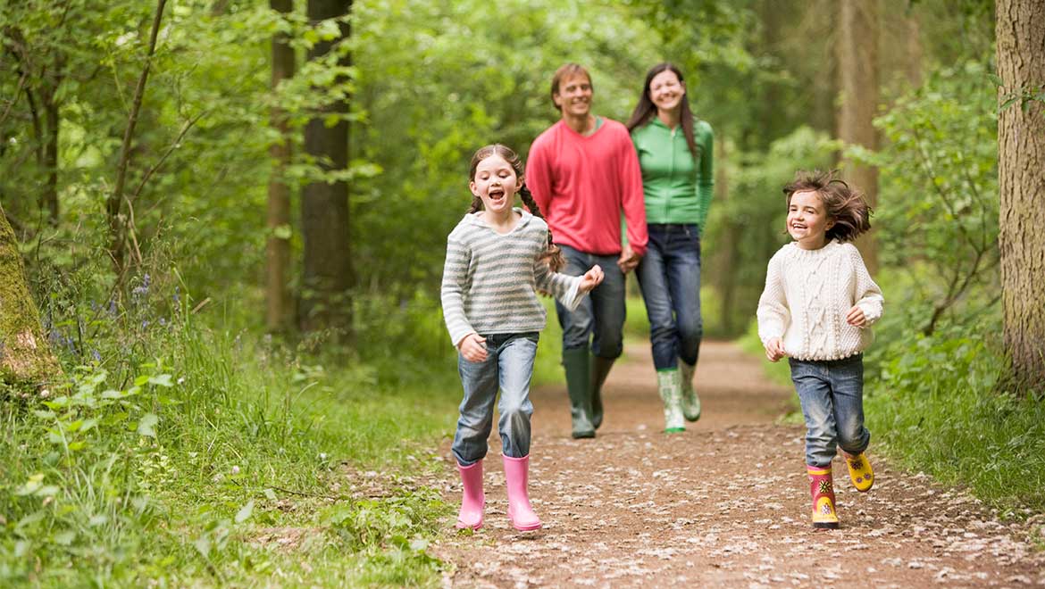 Family walking on trail