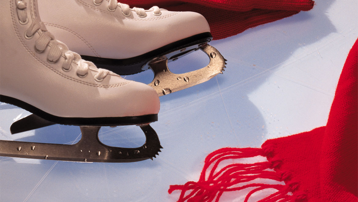 Ice skates and red scarf