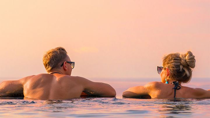 Couple at infinity pool