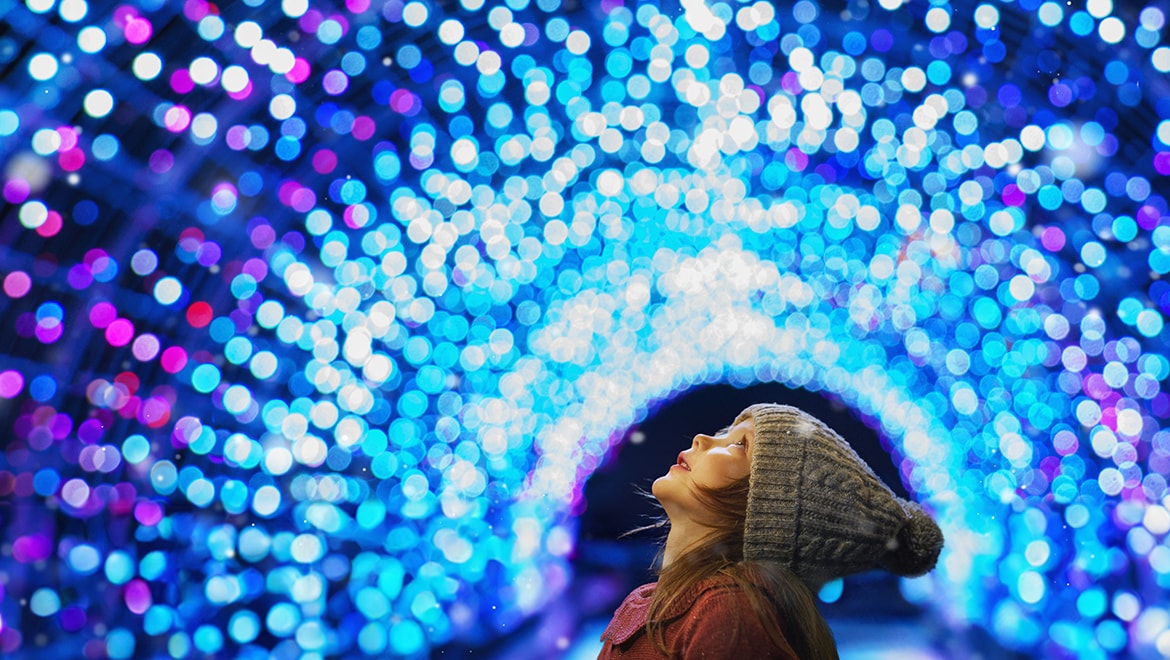 Little girl looking at Christmas lights