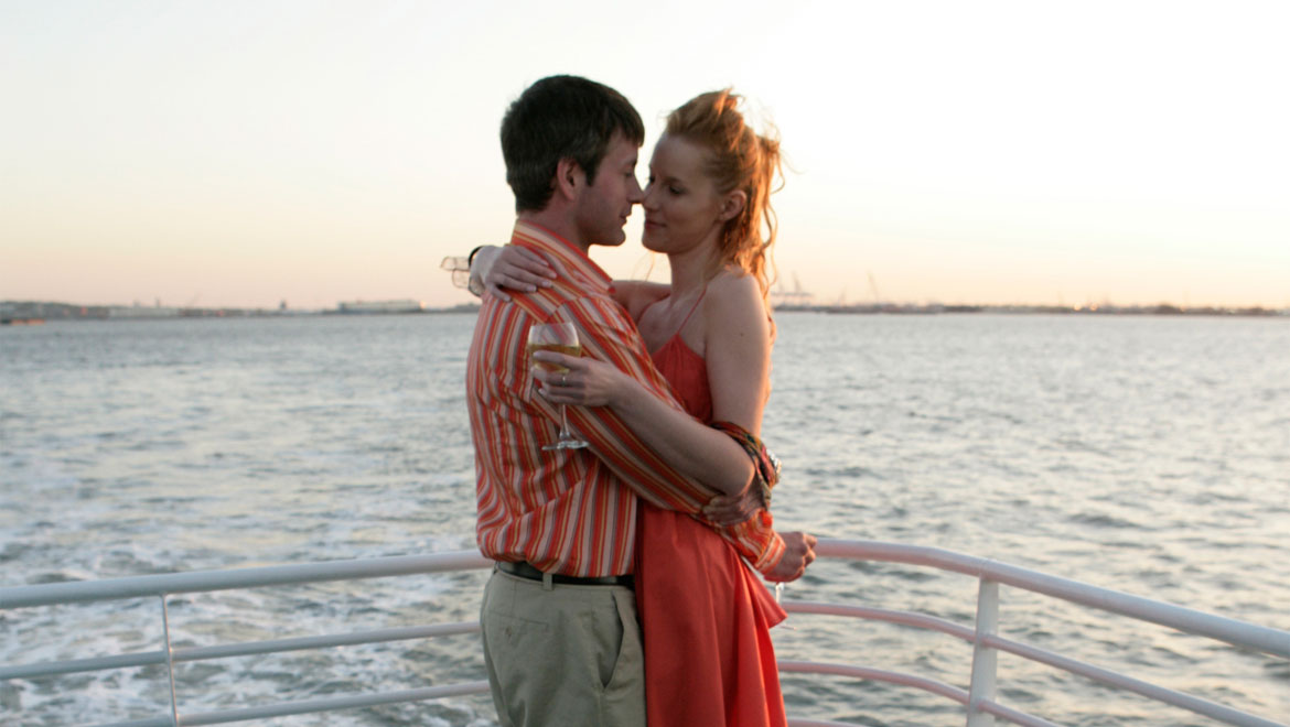 Couple hugginf on boat