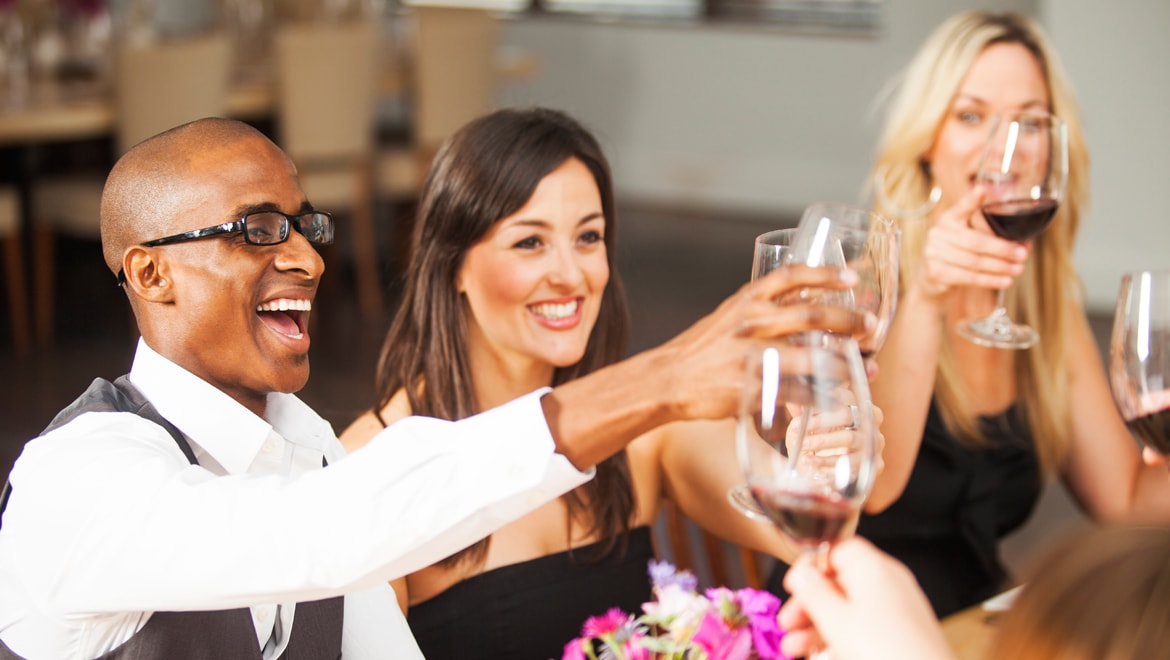 Friends toasting at dinner