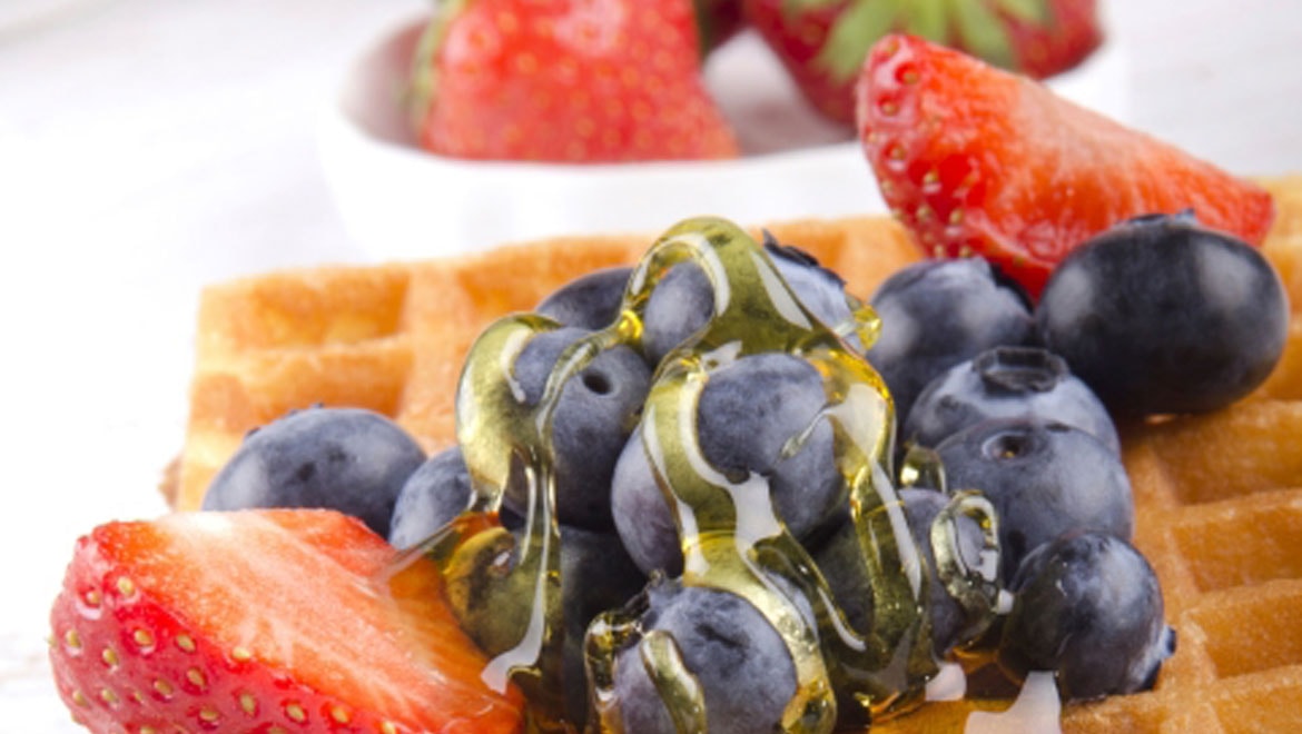 Waffles topped with berries.