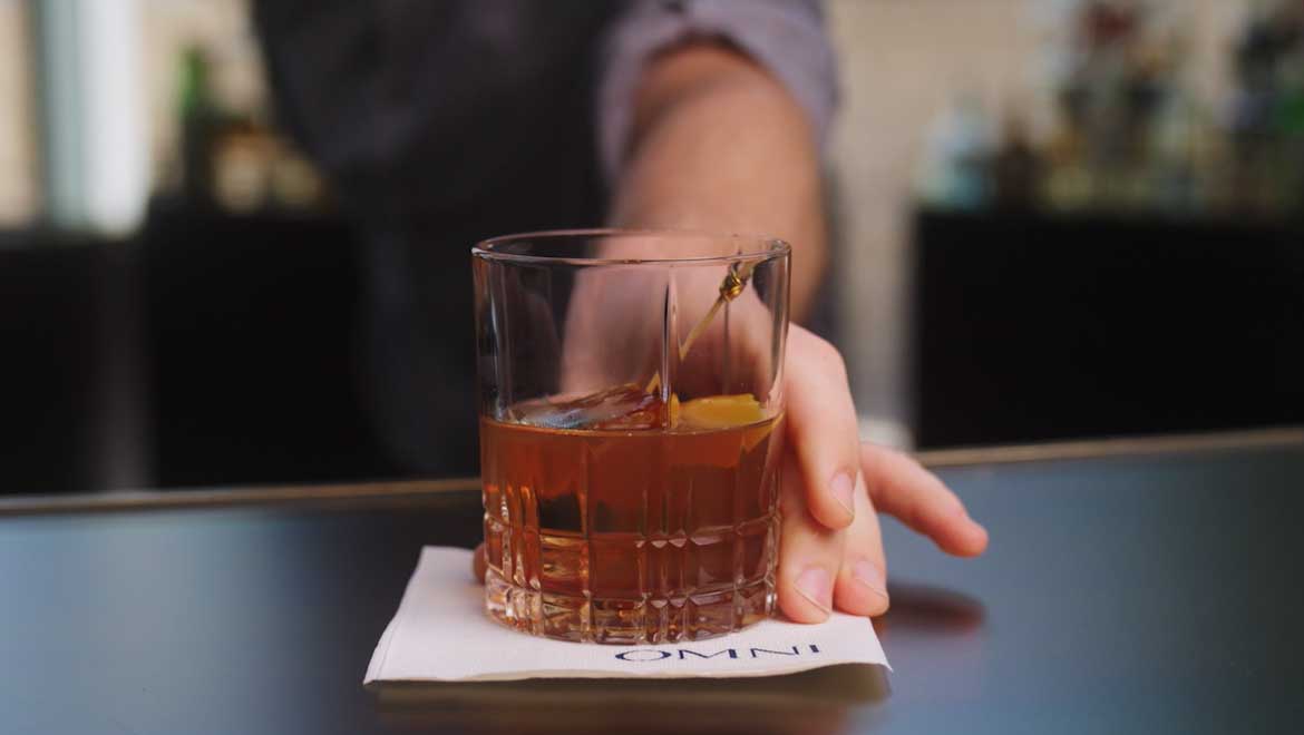 Whiskey served neat on an Omni napkin