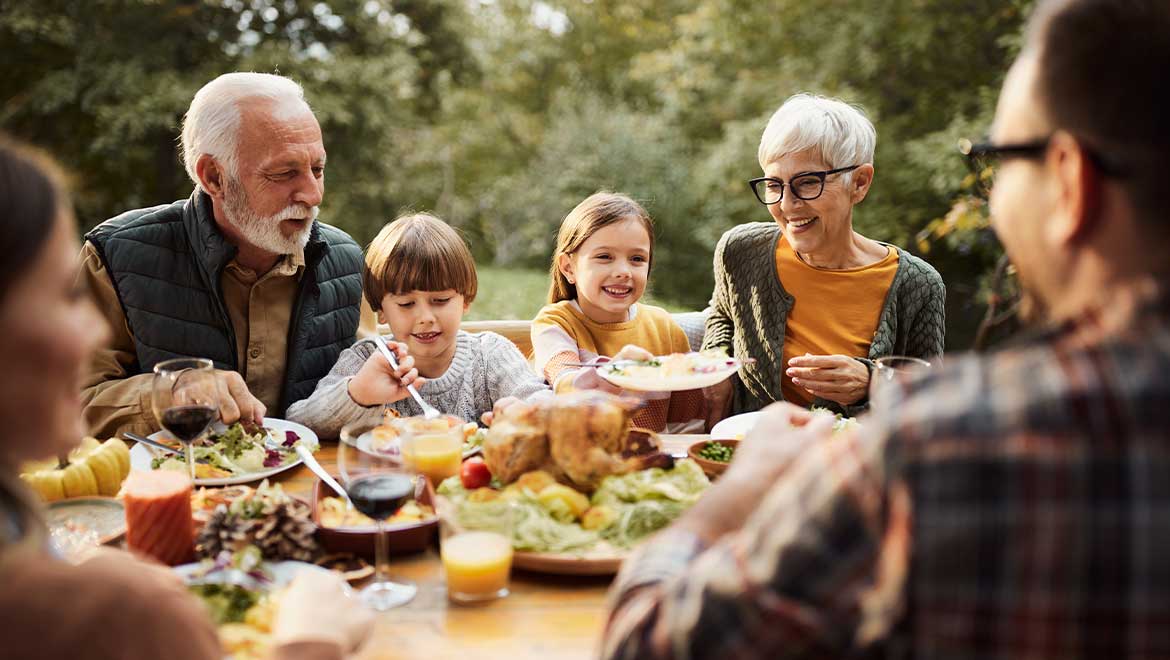 Family sharing a Thanksgiving meal