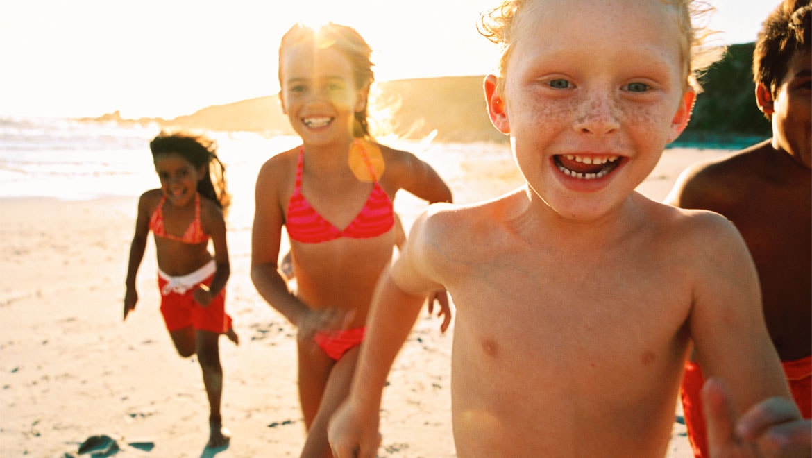 Kids running on the beach