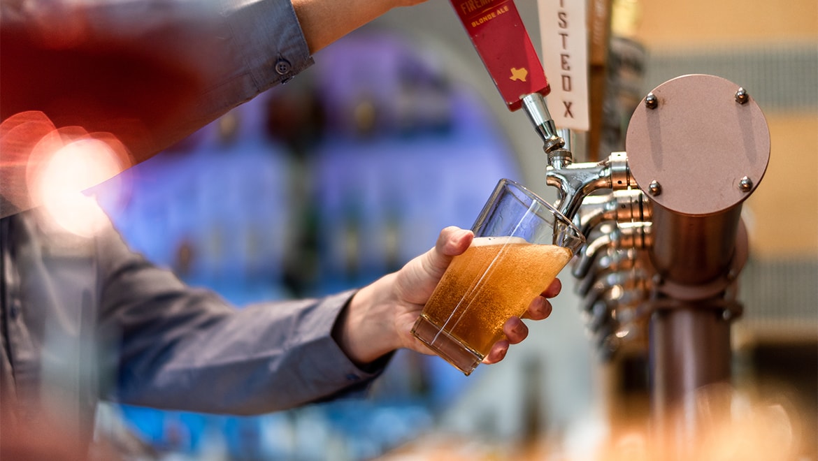 Guy pouring beer