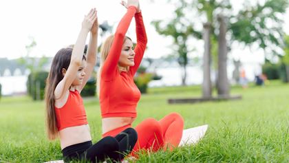 Mother and daughter doing yoga