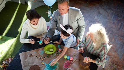 Family painting easter eggs