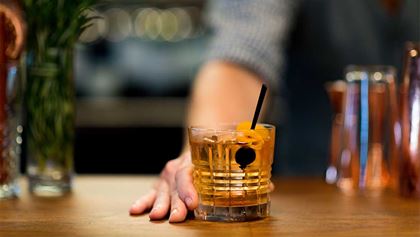 Bartender serving a cocktail