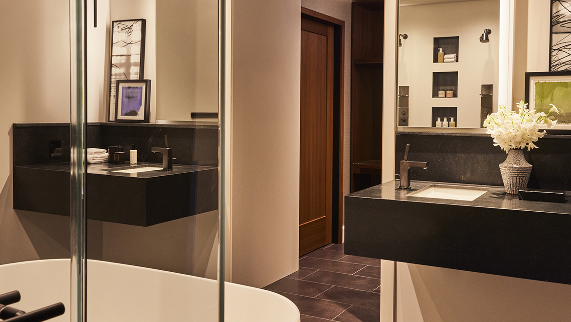 The master bathroom in the Patent No. 2204 presidential suite features a sleek and modern design - Omni Boston Hotel at the Seaport