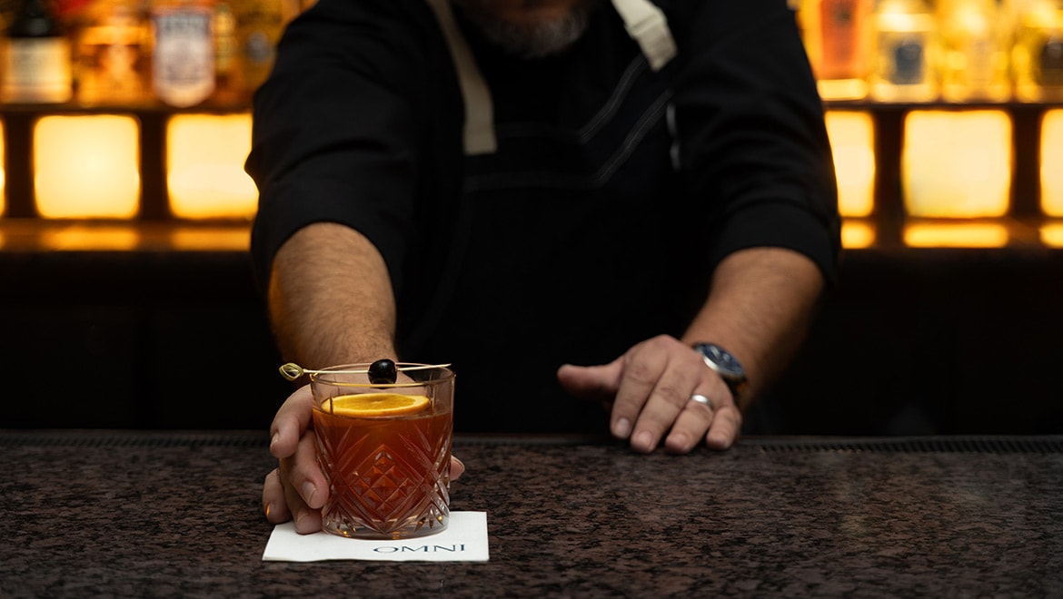 Bartender serving a drink