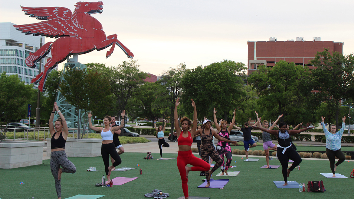 a yoga group practices outside
