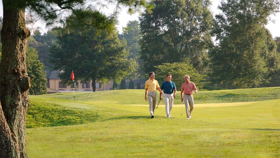 Men walking the   golf course