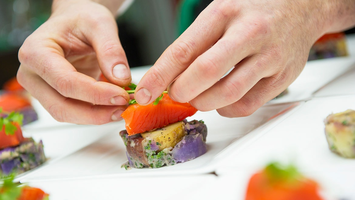 Chef preparing sushi plate