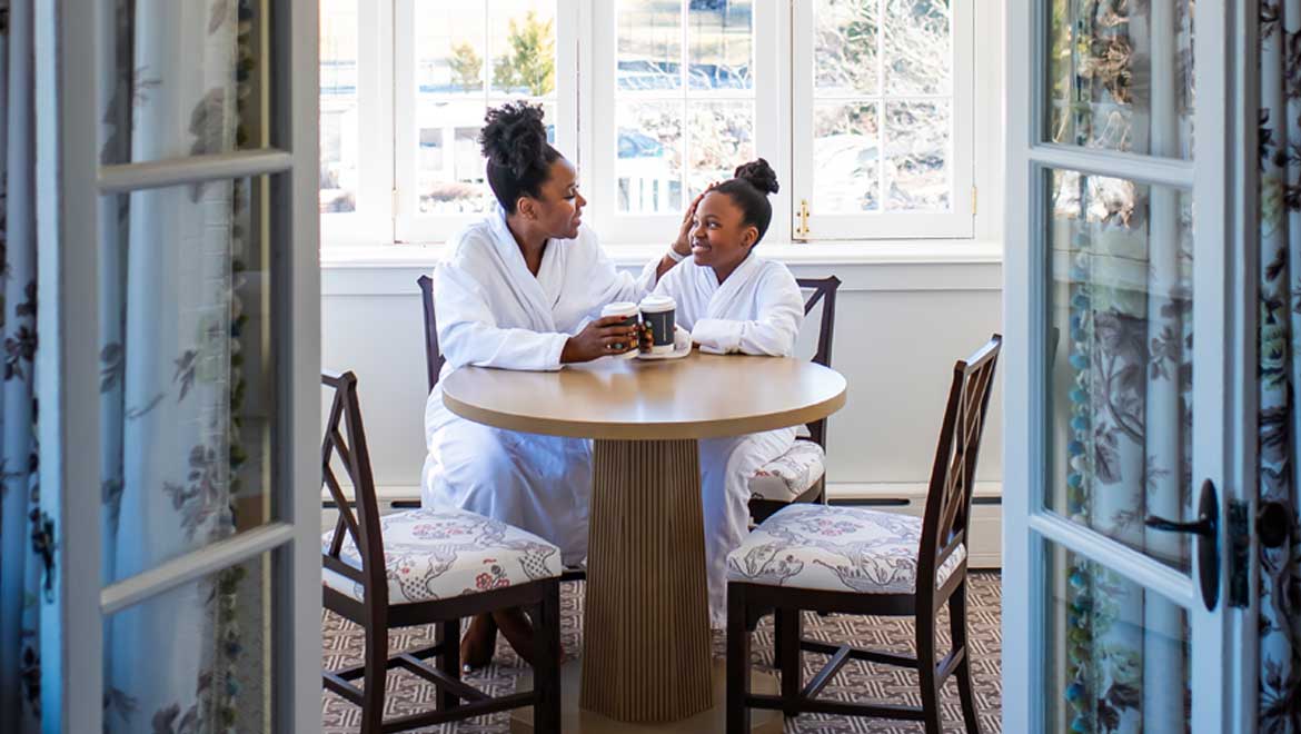 Mother and daughter having breakfast