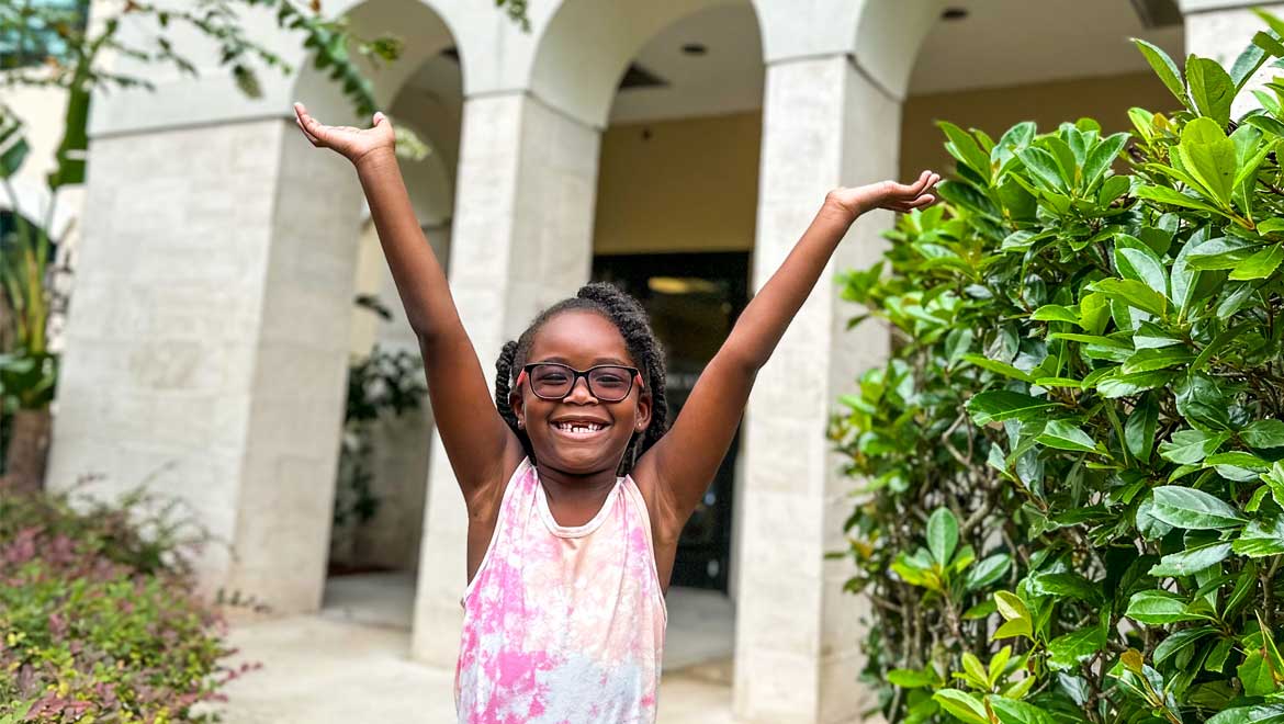 young girl cheering in excitement