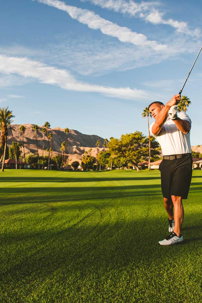 Golfer golfing