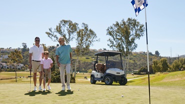 family golfing