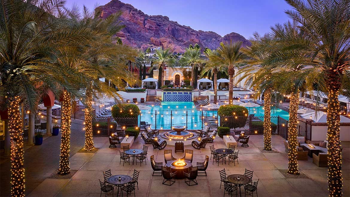 Outdoor pool area with patio seating