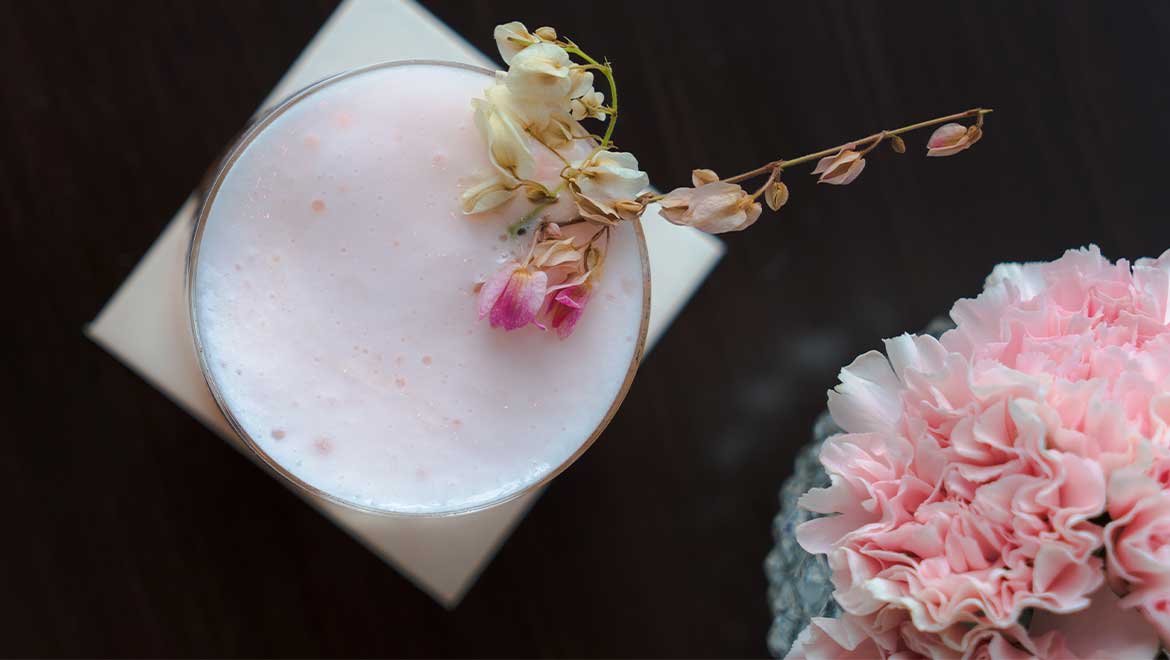 Cocktail with cherry blossom garnishes