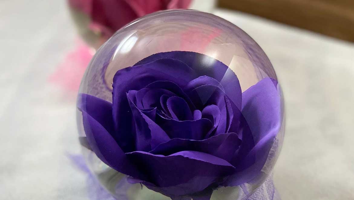 Flower in a glass ball.