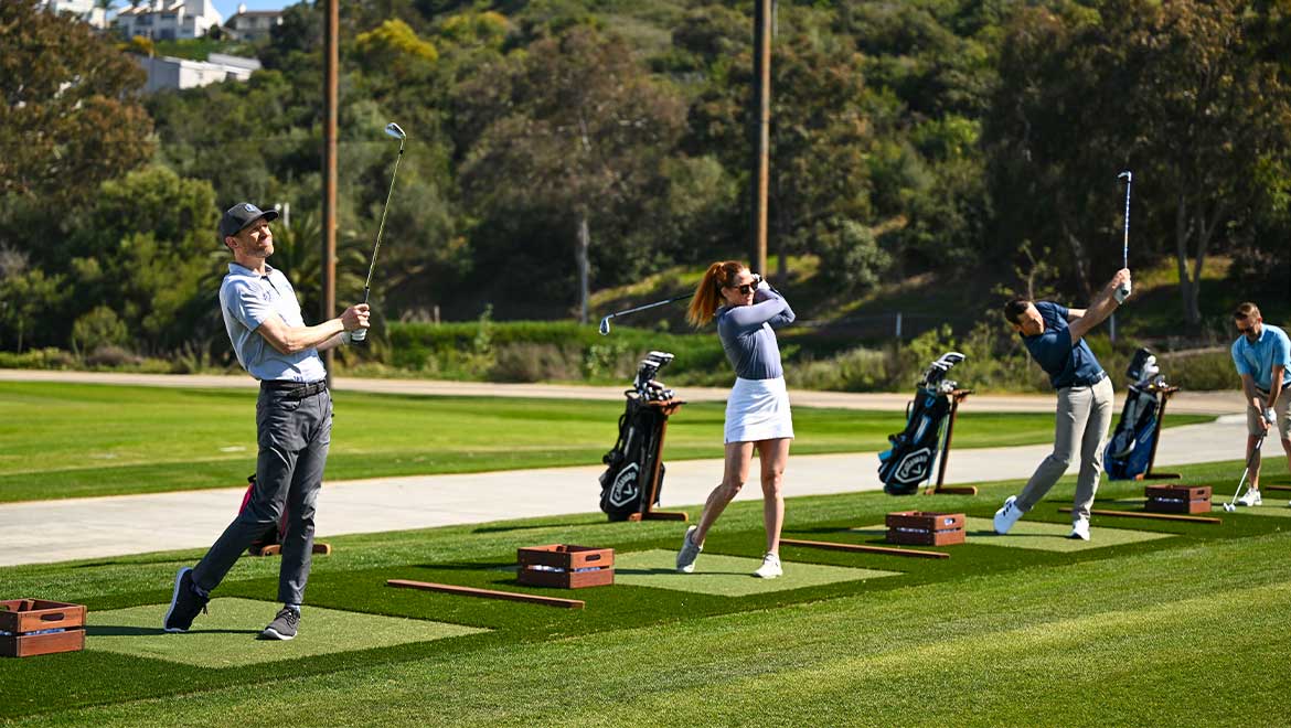 Group of golfers at the driving range