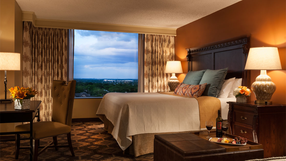Guest room king bed San Antonio Hotel at Colannade 